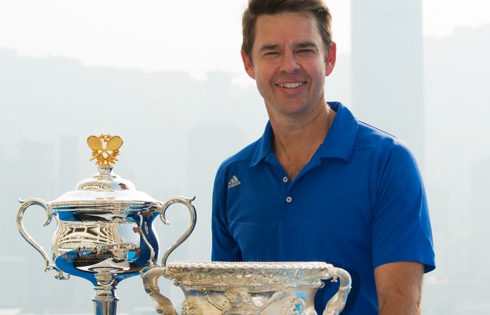 HONG KONG - OCTOBER 22:  Todd Woodbridge poses for the press with the AO trophys over looking the Hong Kong skyline during the Australian Open Trophy tour on October 22, 2013 in Hong Kong, Hong Kong.  (Photo by Gareth Gay/Getty Images)