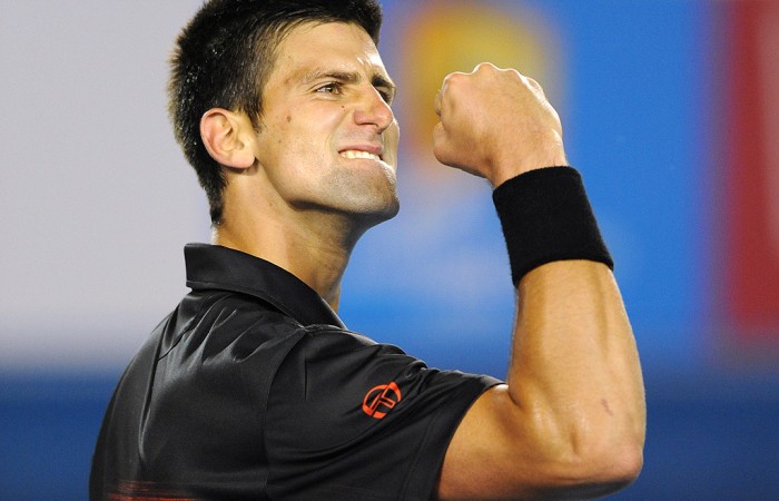 Novak Djokovic of Serbia celebrates winning a point against Jo-Wilfried Tsonga of France in their men's singles quarter-final match on day 10 of the Australian Open tennis tournament in Melbourne on January 27, 2010.       AFP PHOTO / GREG WOOD (Photo credit should read GREG WOOD/AFP/Getty Images)