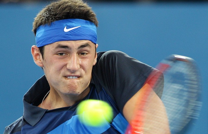 Bernard Tomic plays a backhand during his first round match against Florian Mayer at the Brisbane International. GETTY IMAGES