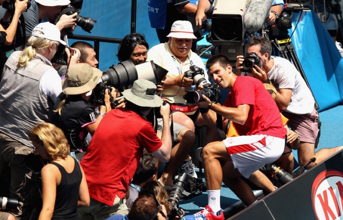 Novak Djokovic lunged into the photographers pit.