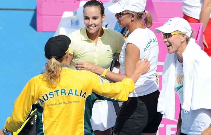 Jarmila Groth celebrates her win with the Australian Fed Cup team. Getty Images