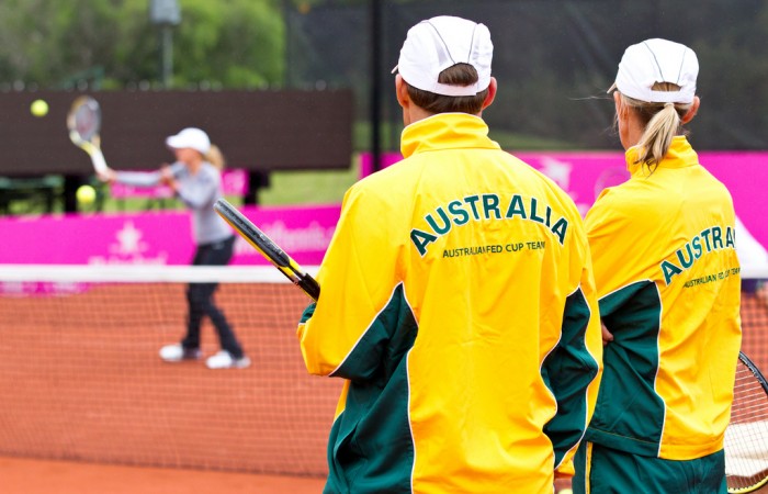 13th of April 2011. Dave Taylor and Nicole Bradtke watch Anastasia Rodionova at practice ahead of the Australia v Ukraine Federation Cup tie. Mark Riedy.