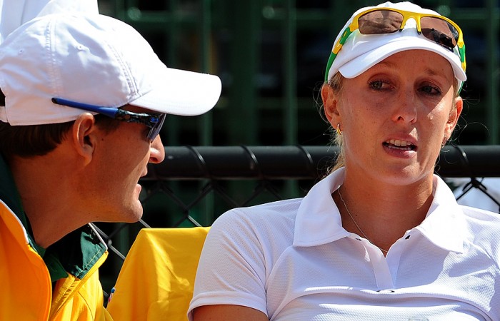 Fed Cup captain Dave Taylor (left) speaks to Anastasia Rodionova. Getty Images