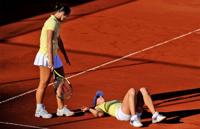 ustralia's Jarmila Groth (L) helps teammate Anastasia Rodionova (R) to her feet during their loss to Ukraine's Lesia Tsurenko and Olga Savchuk in the doubles of their Fed Cup tennis tie, in Melbourne. Getty Images.