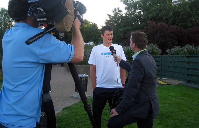 Bernard Tomic talks to the media after his third round win over Robin Soderling at Wimbledon. 