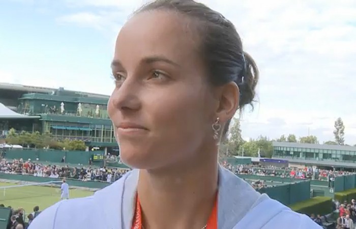 Jarmila Gajdosova conducts an interview at Wimbledon. 