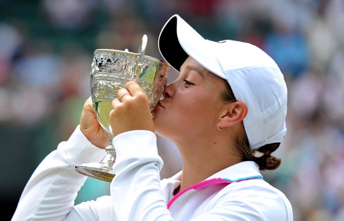 Ashleigh Barty of Australia kisses her trophy after winning her final round Girls' match against Irina Khromacheva of Russia on Day Thirteen of the Wimbledon Lawn Tennis Championships at the All England Lawn Tennis and Croquet Club. Getty Images.