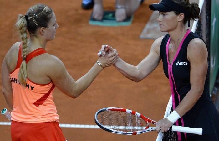 Kerber (L) and Stosur shake hands after Stosur recorded a 7-6(1) 6-4 victory to hand Australia an early 1-0 lead in the tie; Getty Images