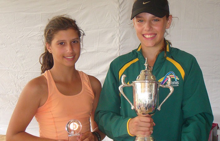 Aleksa Cvetacanin (R) holds aloft the winners trophy after defeating top seed and doubles partner Jaimee Fourlis in the girls singles final at the Optus 12s National Claycourt Championships; Tennis Australia