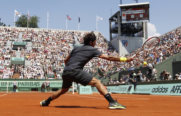 World No.3 Roger Federer swats a forehand back in his match against German Tobias Kamke on Court Suzanne Lenglen during Day 2 of the French Open, which he won 6-2 7-5 6-3; Getty Images