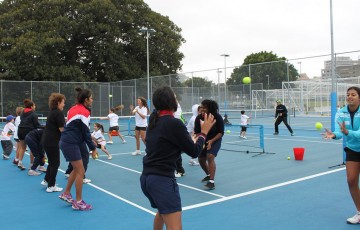 Evonne Goolagong Cawley (fifth from left) warms up along with other Indigenous participants at the Tennis Come and Try Day in Sydney as part of the Learn Earn Legend! initiative; Tennis Australia