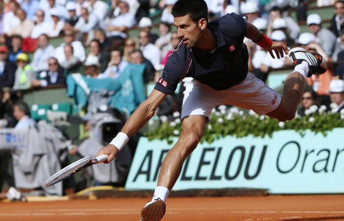 World No.1 Novak Djokovic stretches for a ball during his straight set victory over Roger Federer in the French Open semifinals on Friday; Getty Images