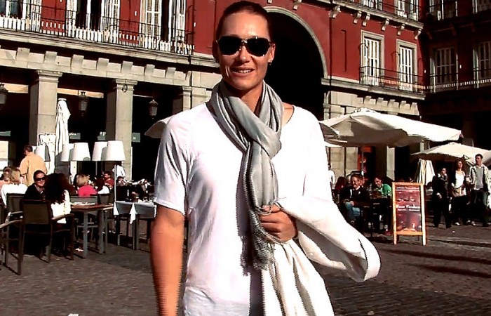 Sam Stosur poses in Madrid's Plaza Mayor as host of the WTA Full of Surprises travel show; WTA