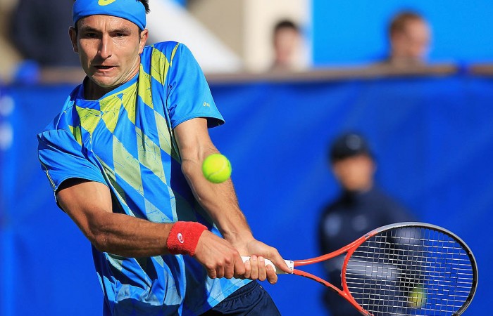 Marinko Matosevic plays a backhand during his first round match against Britain's James Ward at the ATP event in Eastbourne. Having come through qualifying, Matosevic continued his roll with a three-set win over the Brit; Getty Images