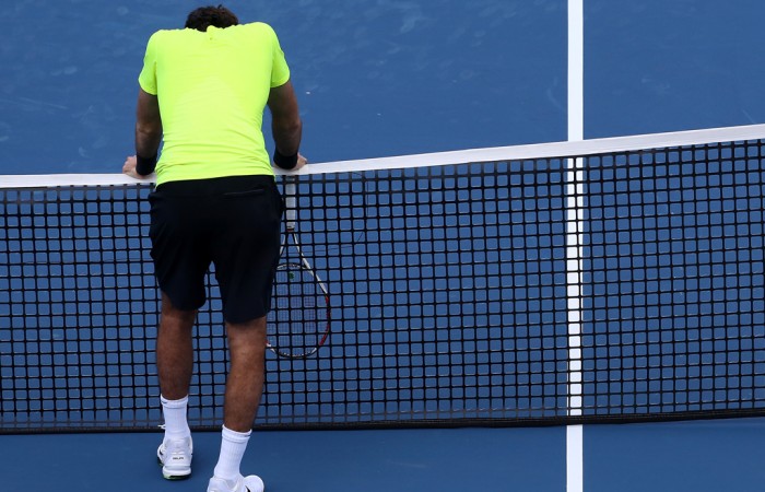 Juan Martin Del Potro leans on the net after losing a point to Novak Djokovic during their semifinal match at the Cincinnati Masters. Djokovic won 6-3 6-2; Getty Images