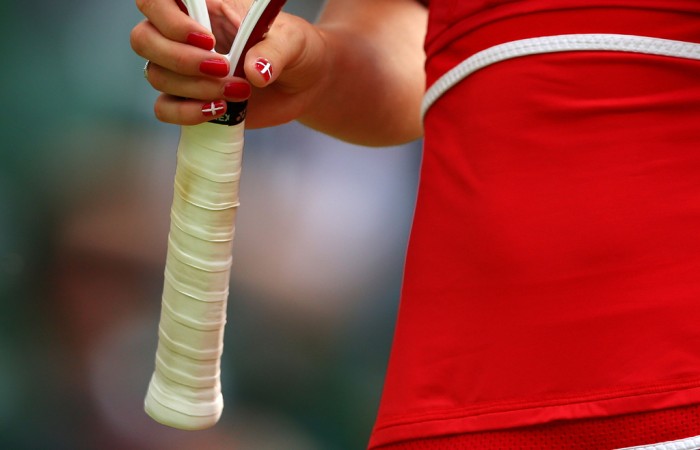 The flag of Denmark is seen painted on the fingers of Dane Caroline Wozniacki during the London Olympics tennis event; Getty Images)