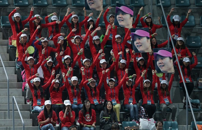Fans of China's Li Na urge her on during her women's singles third round match against compatriot Peng Shuai at the China Open in Beijing; Getty Images