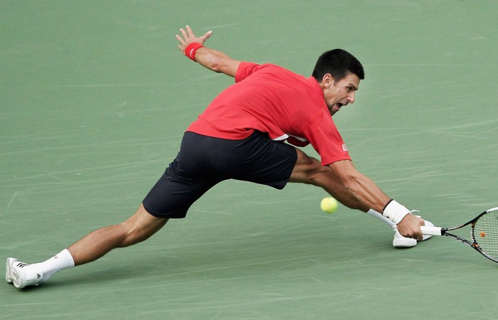 Novak Djokovic demonstrates his trademark flexibility and retrieving skills in his second round victory over Grigor Dimitrov at the Shanghai Rolex Masters in Shanghai, China; Getty Images