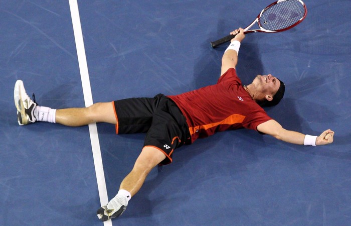 Lleyton Hewitt celebrates upsetting Milos Raonic of Canada in the third round of Australian Open 2012; Getty Images