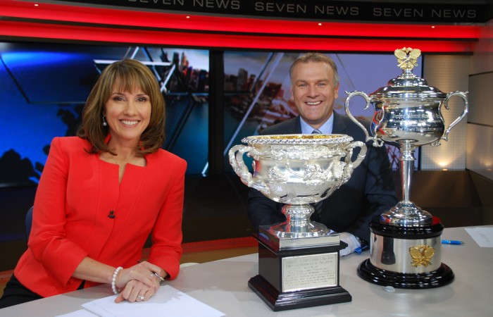 The Australian Open trophies drop in during the Seven News in Sydney with Chris Bath (L) and Jim Wilson; Tennis Australia