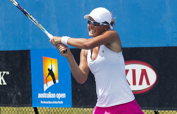 Arina Rodionova in action against Jess Moore in the quarterfinals of the Australian Open 2013 Play-off; Georgina Leeder