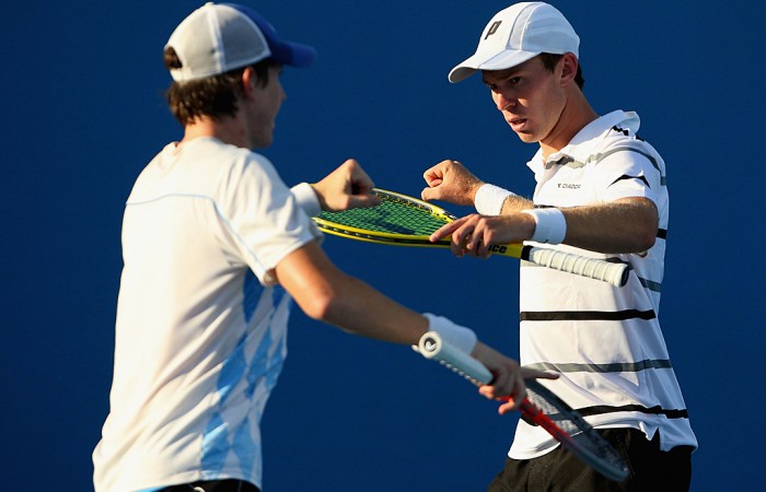 John-Patrick Smith of Australia in action with John Peers of Australia in their first round doubles match against Marcin Matkowski of Poland and Mariusz Fyrstenberg (L) of Poland during day four of the 2013 Australian Open at Melbourne Park on January 17, 2013 in Melbourne, Australia; Getty Images