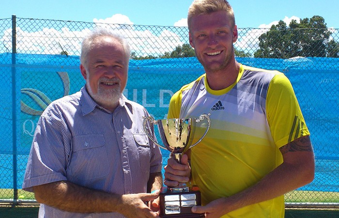 Mildura Grand International champion Sam Groth (R) is presented with the winner's trophy by Mildura Mayor Glenn Milne; Tennis Australia