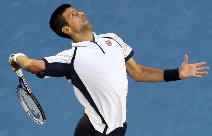 Novak Djokovic hits a serve in his quarterfinal match against Tomas Berdych at Australian Open 2013; Getty Images