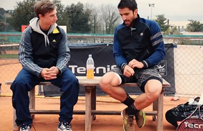 Janko Tipsarevic (R) advises Aussie junior Omar Jasika on the best way to play on clay; Tecnifibre