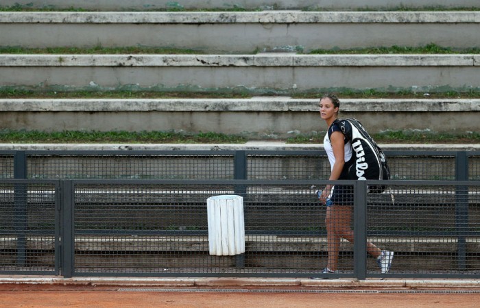 Laura Robson casts a lonely figure as she leaves the court following a doubles loss at the Internazionali BNL d'Italia; Getty Images