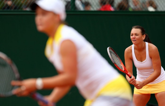 Despite fighting hard, Casey Dellacqua (R) and Ashleigh Barty (foreground, blurred) went down 3-6 6-4 6-3 to Mona Barthel of Germany and Liga Dekmeijere of Latvia  in the first round of the women's doubles at the French Open; Getty Images