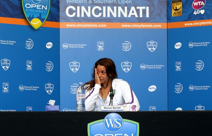 Marion Bartoli of France tearfully announces her retirement from professional tennis during a press conference following her second-round loss to Simona Halep at the Western & Southern Open in Cincinnati, Ohio; Getty Images