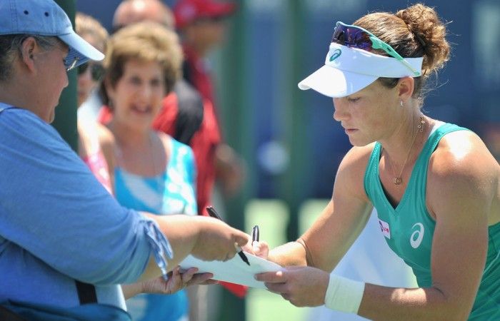 Following her 7-5 6-1 first round victory over Varvara Lepchenko at the WTA Southern California Open, Sam Stosur signs her autograph for a fan; Getty Images