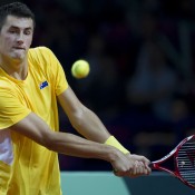 Bernard Tomic in action against Lukasz Kubot during the first reverse singles rubber of the Australia v Poland Davis Cup World Group Play-off tie in Warsaw, Poland; Getty Images