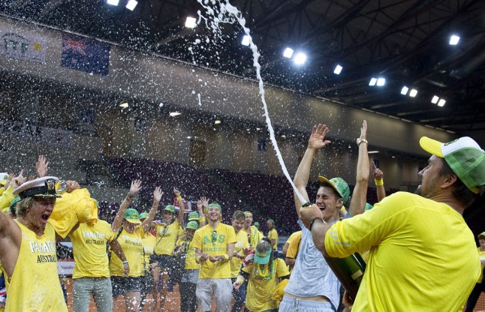 Australian Davis Cup captain Patrick Rafter (R) sprays champagne in celebration of Australia's 4-1 victory over Poland in the Davis Cup World Group Play-offs in Warsaw, promoting Australia to the World Group for the first time since 2007; Getty Images