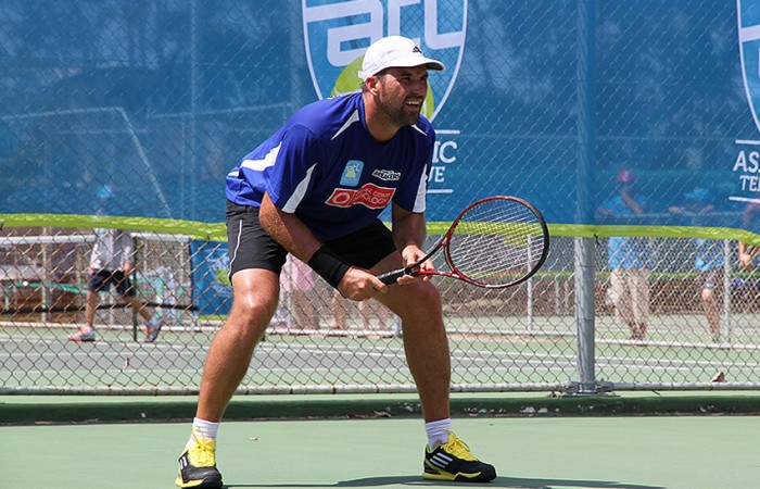 Pat Rafter signs in action during his win for Sunshine Coast Breakers in the ATL Queensland Conference against Gavin Van Peperzeel of the Tennis Brisbane Chargers; Tennis Queensland
