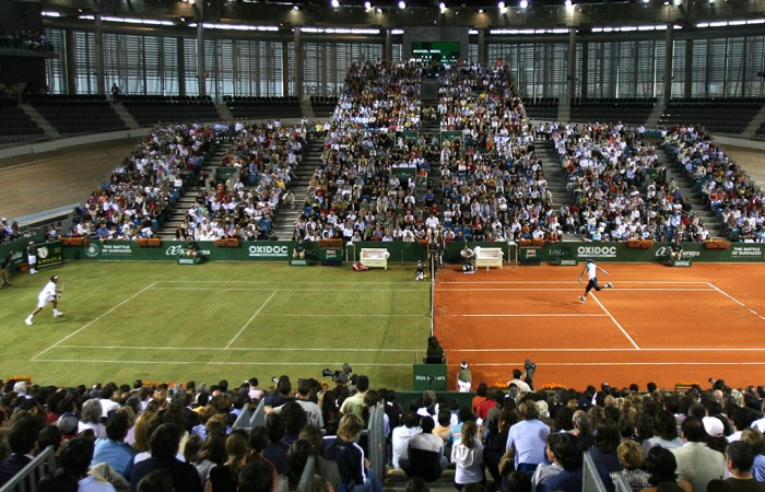 Spain's Rafael Nadal (R) and Swiss Roger Federer play during the exhibition game 