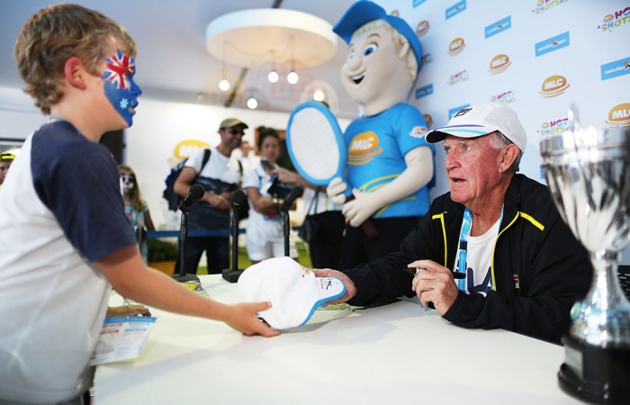 MELBOURNE, AUSTRALIA - JANUARY 19:  Australian tennis great Tony Roche signs his autograph for a fan at the MLC Fan Zone on Grand Slam Oval during day 7 of the 2014 Australian Open at Melbourne Park on January 19, 2014 in Melbourne, Australia.  (Photo by Graham Denholm/Getty Images)