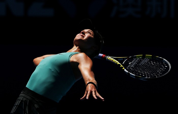 MELBOURNE, AUSTRALIA - JANUARY 21:  Eugenie Bouchard of Canada serves in her quarterfinal match against Ana Ivanovic of Serbia during day nine of the 2014 Australian Open at Melbourne Park on January 21, 2014 in Melbourne, Australia.  (Photo by Michael Dodge/Getty Images)