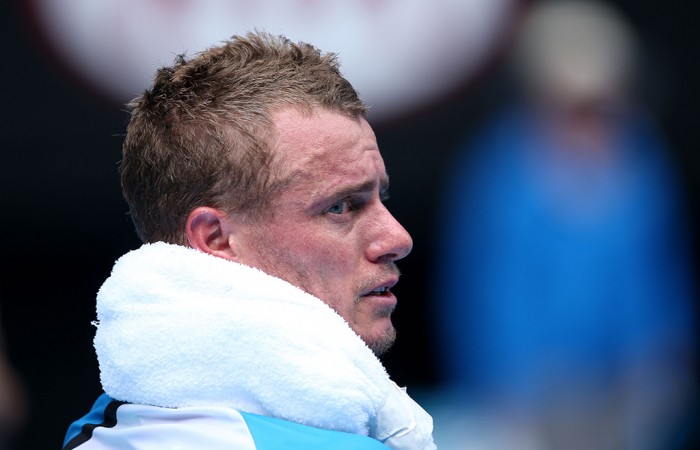 Lleyton Hewitt of Australia cools down during a break in his first round match against Andreas Seppi of Italy during day two of the 2014 Australian Open at Melbourne Park on January 14, 2014 in Melbourne, Australia.  (Photo by Clive Brunskill/Getty Images)