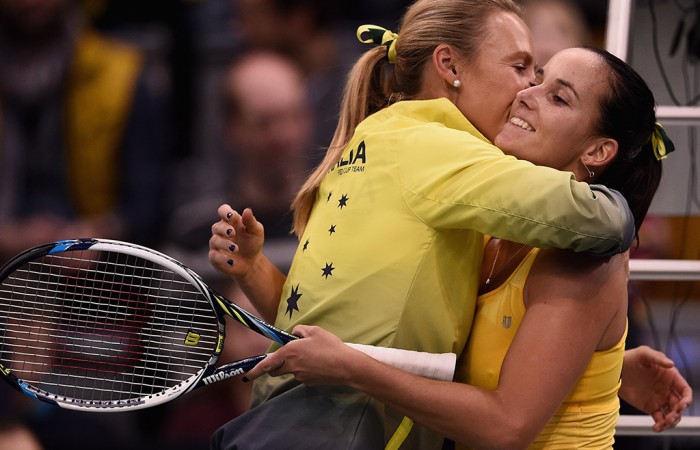 Australian Fed Cup captain Alicia Molik (L) embraces Jarmila Gajdosova following Gajdosova's victory over Angelique Kerber; Getty Images