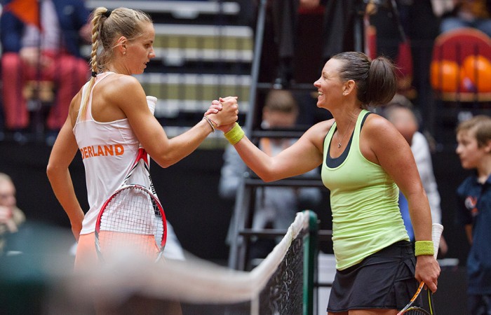 Casey Dellacqua (R) shakes hands with Arantxa Rus after winning their second singles rubber in the Netherlands v Australia Fed Cup World Group Play-off tie in 's-Hertogenbosch; Henk Koster