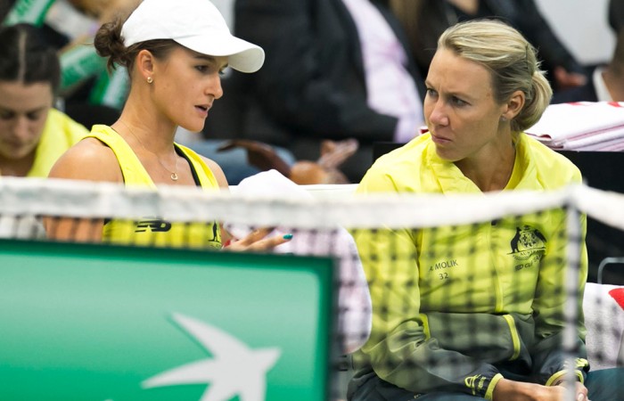 Arina Rodionova (L) consults with captain Alicia Molik during the first singles rubber of the Australia v Slovakia World Group II first round tie in Bratislava; Roman Benicky