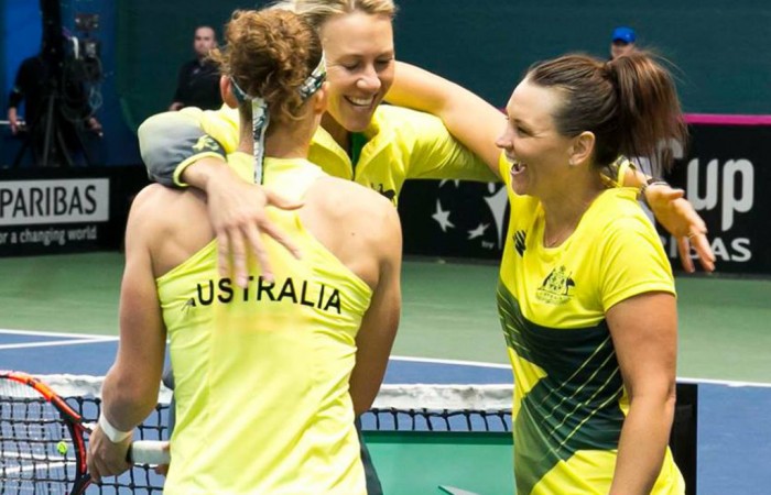 (L-R) Sam Stosur, Alicia Molik and Casey Dellacqua celebrate victory in the Australia v Slovakia Fed Cup tie in Bratislava; Roman Benicky