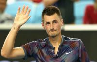 Bernard Tomic salutes the crowd at Melbourne Park.