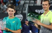 De Minaur and Medvedev with their Sydney trophies.