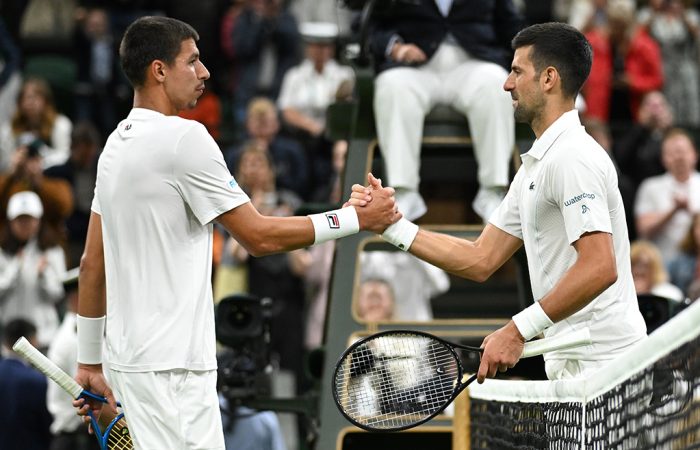 Alexei Popyrin and Novak Djokovic shake hands after their third-round clash at Wimbledon 2024. Picture: Getty Images