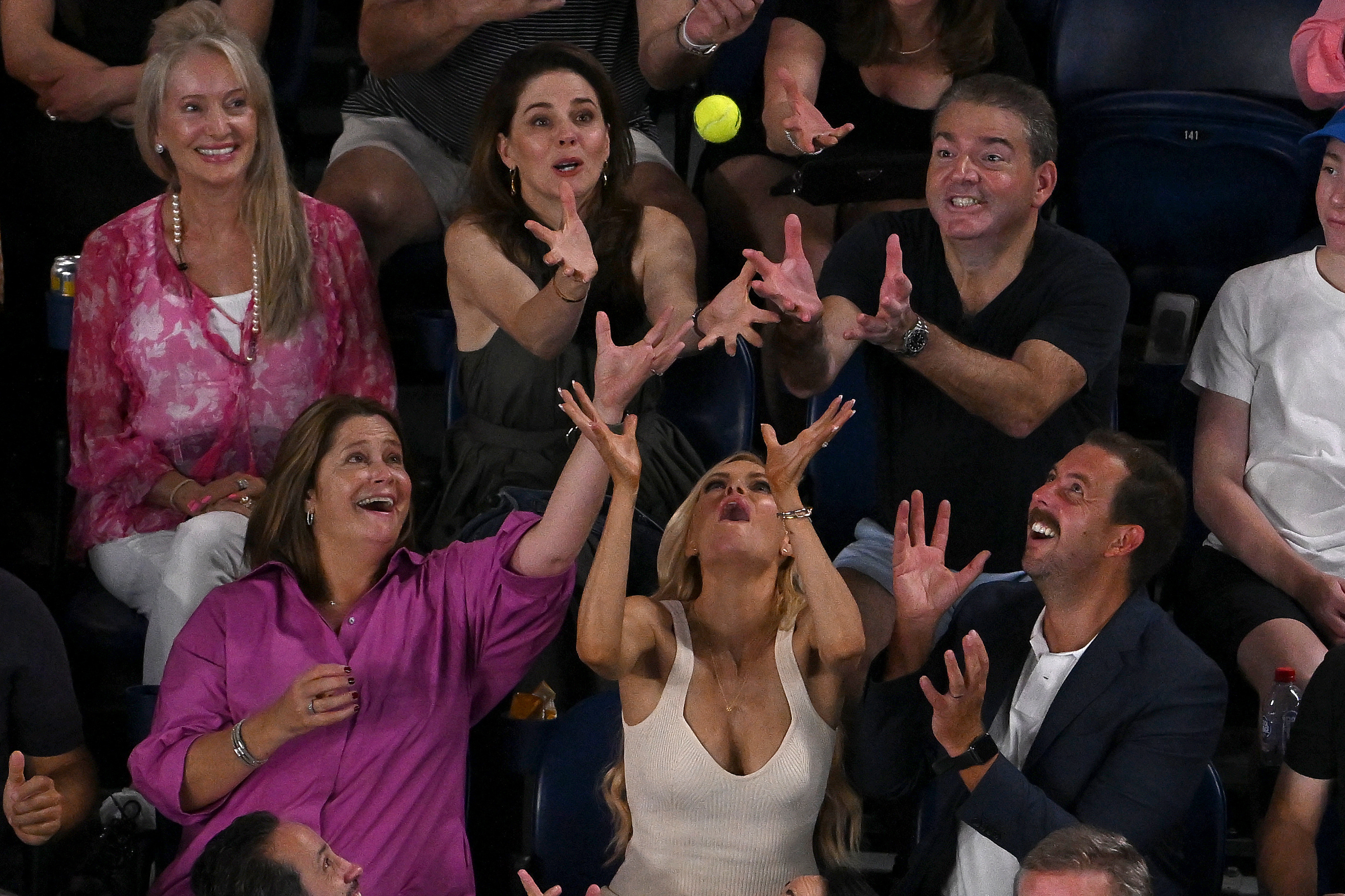 Sophie Monk attempts to catch a ball in the crowd during the Australian Open 2023 final. Picture: Tennis Australia