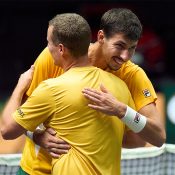 Alexei Popyrin celebrates his win over Pedro Martinez with Australian Davis Cup captain Lleyton Hewitt. [Getty Images]