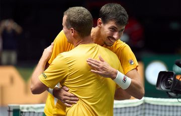 Alexei Popyrin celebrates his win over Pedro Martinez with Australian Davis Cup captain Lleyton Hewitt. [Getty Images]